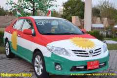 Kurdistan flag painted on a car